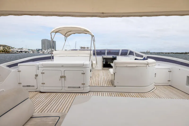 Slide: The Image of Luxurious 1999 Azimut 100 Jumbo yacht deck with seating and ocean view. - 19