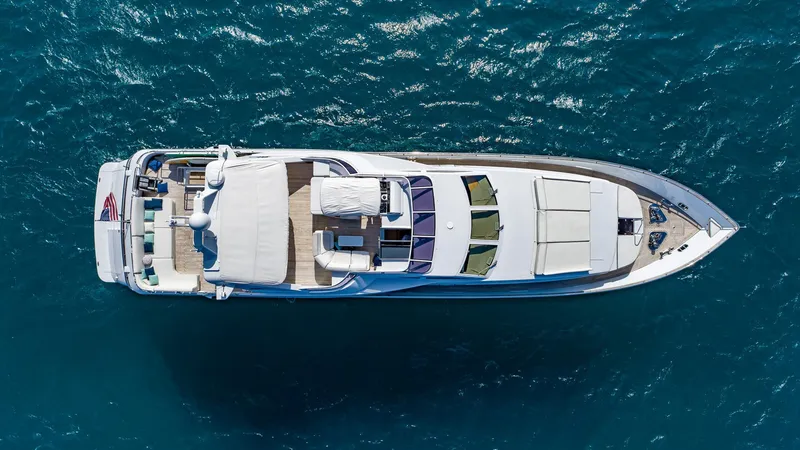 Slide: The Image of Aerial view of 1999 Azimut 100 Jumbo yacht on blue ocean water. - 2