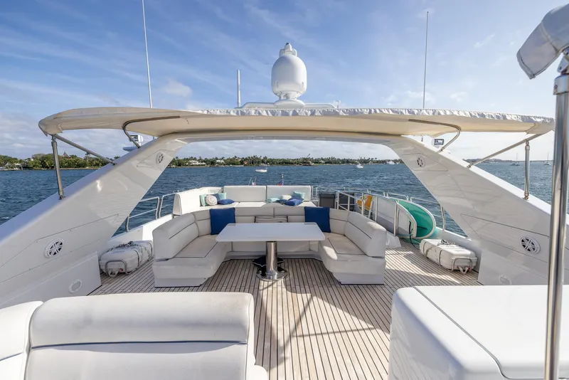 Slide: The Image of Luxurious Azimut 100 Jumbo yacht deck with elegant seating, ocean view, and clear skies. - 22