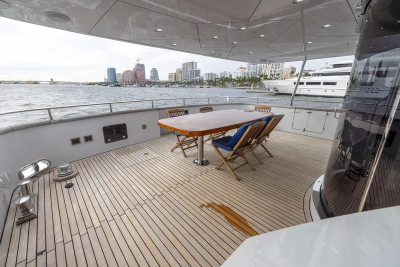 Slide: The Image of Spacious deck of 1999 Azimut 100 Jumbo yacht with city skyline view. - 28