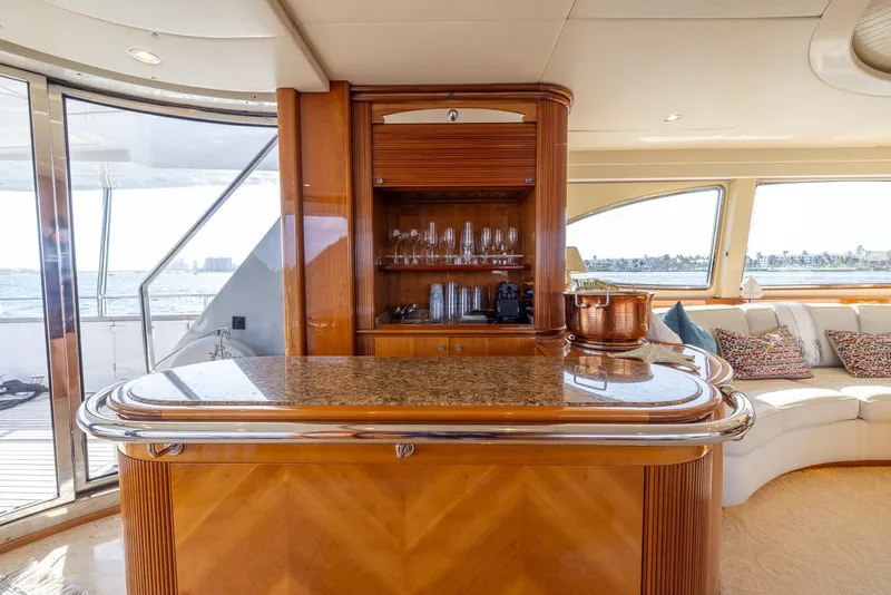 Slide: The Image of Luxurious interior of 1999 Azimut 100 Jumbo yacht with elegant bar and seating area. - 31