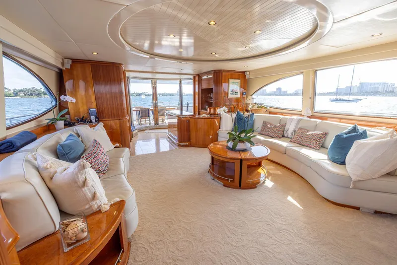 Slide: The Image of Luxurious interior of 1999 Azimut 100 Jumbo yacht with elegant seating and panoramic windows. - 32
