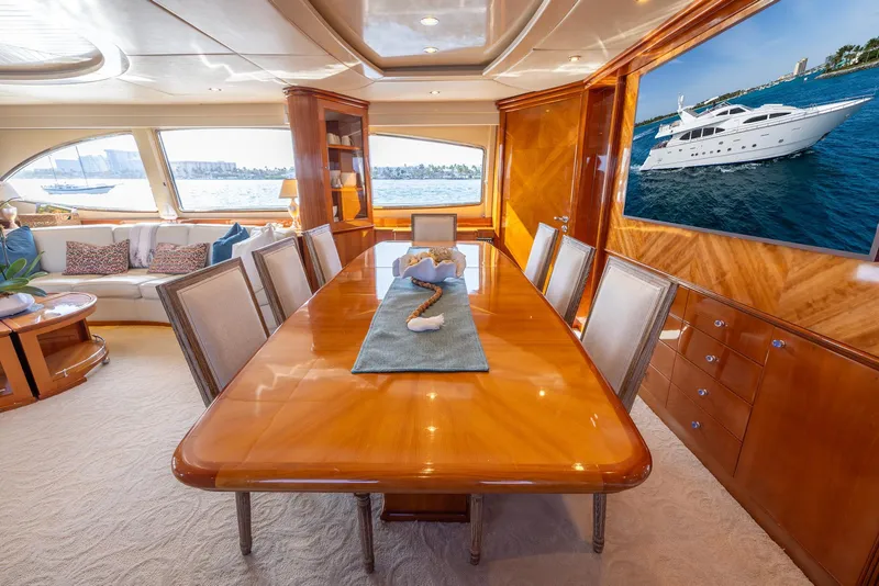 Slide: The Image of Luxurious dining area in 1999 Azimut 100 Jumbo yacht with elegant wood finishes. - 34