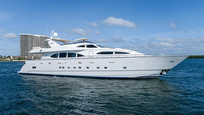 Slide: The Image of Luxurious 1999 Azimut 100 Jumbo yacht on serene blue waters, showcasing elegant design. - 7
