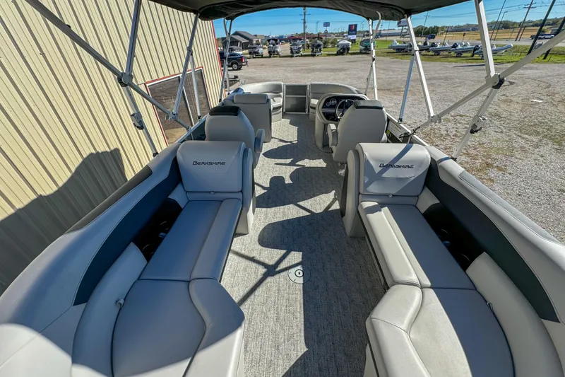 Slide: The Image of 2024 Berkshire 24RFX LE pontoon boat interior with gray seating and canopy. - 11