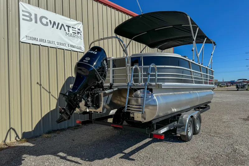 Slide: The Image of 2024 Berkshire 24RFX LE pontoon boat on trailer at Big Water Marine dealership. - 7