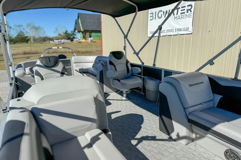 Slide: The Image of 2024 Berkshire 24RFX LE pontoon boat interior with plush seating and canopy. - 8