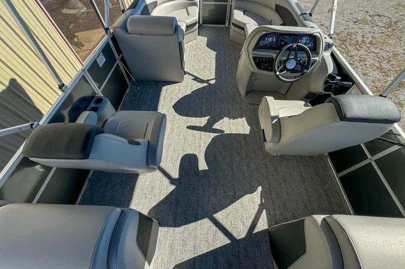 Slide: The Image of 2024 Berkshire 24RFX LE pontoon boat interior with plush seating and modern helm. - 9