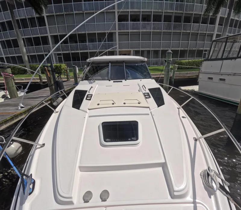 Slide: The Image of 2015 Regal 35 Sport Coupe docked at marina, front view. - 21