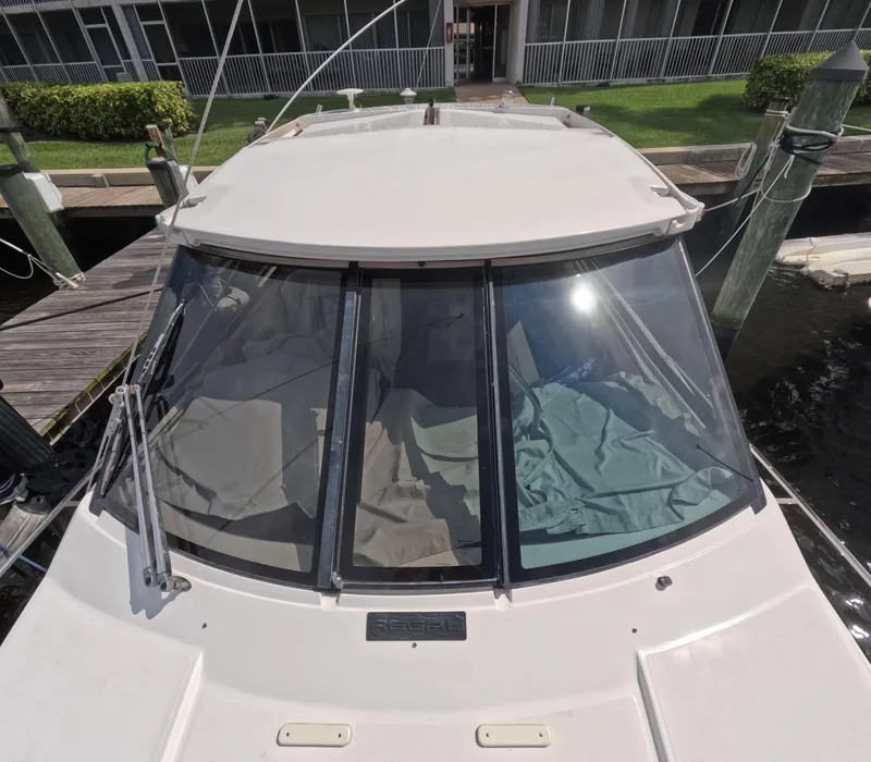 Slide: The Image of 2015 Regal 35 Sport Coupe docked at marina, front view. - 22