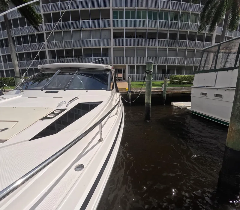 Slide: The Image of 2015 Regal 35 Sport Coupe docked near waterfront building. - 25