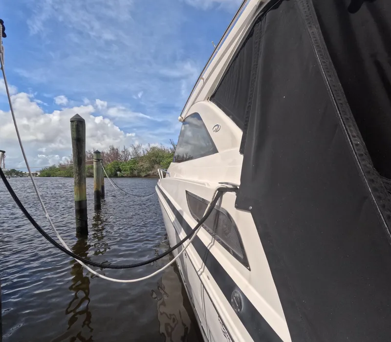 Slide: The Image of 2015 Regal 35 Sport Coupe docked on a sunny day. - 8