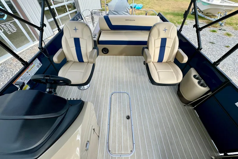 Slide: The Image of 2024 Berkshire 24UL CTS boat interior with beige seating and modern design. - 10