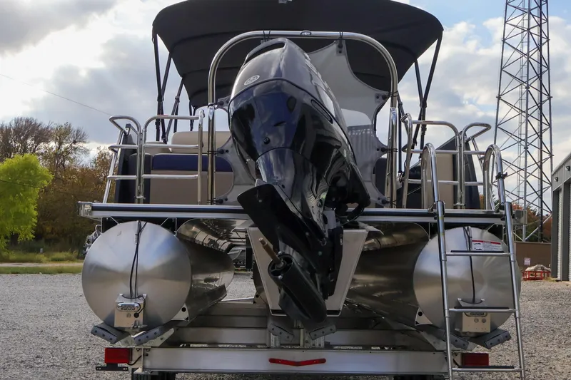 Slide: The Image of 2024 Berkshire 24UL CTS pontoon boat with outboard motor, rear view. - 6