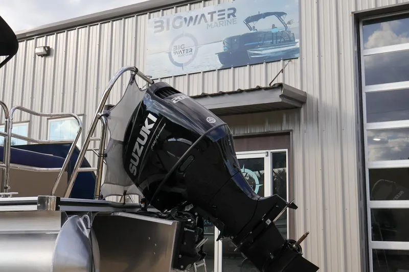 Slide: The Image of 2024 Berkshire 24UL CTS with Suzuki outboard at Big Water Marine dealership. - 7