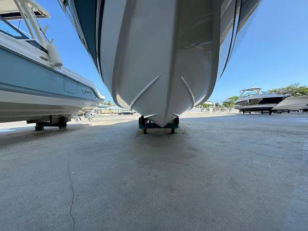 Slide: The Image of 2023 Cobalt R8 Outboard boat on dry dock, viewed from below. - 17