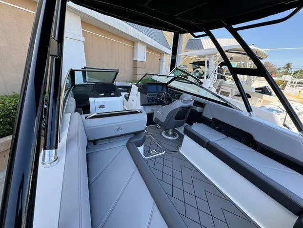 Slide: The Image of 2023 Cobalt R8 Outboard boat interior with modern seating and sleek design. - 23
