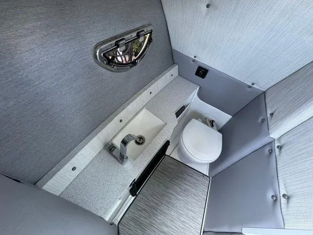 Slide: The Image of 2023 Cobalt R8 Outboard boat interior bathroom with sink and toilet. - 28