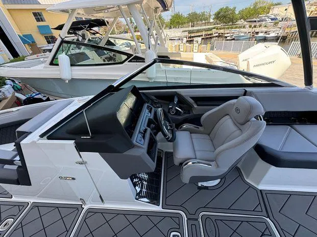 Slide: The Image of 2023 Cobalt R8 Outboard boat interior with modern dashboard and comfortable seating. - 29