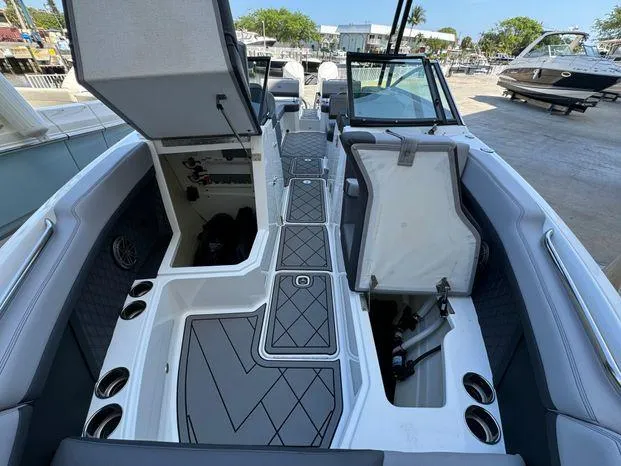 Slide: The Image of 2023 Cobalt R8 Outboard boat interior with open storage compartments and sleek design. - 36