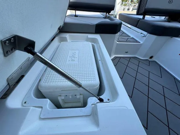 Slide: The Image of 2023 Cobalt R8 Outboard boat interior with built-in cooler storage. - 47