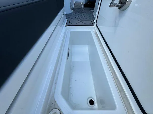 Slide: The Image of 2023 Cobalt R8 Outboard boat storage compartment with sleek interior design. - 50