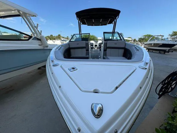 Slide: The Image of 2023 Cobalt R8 Outboard boat with sleek design, docked at marina. - 6