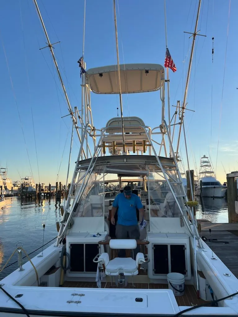 Slide: The Image of 1998 Albemarle 320 Express Fisherman docked at marina during sunset. - 19