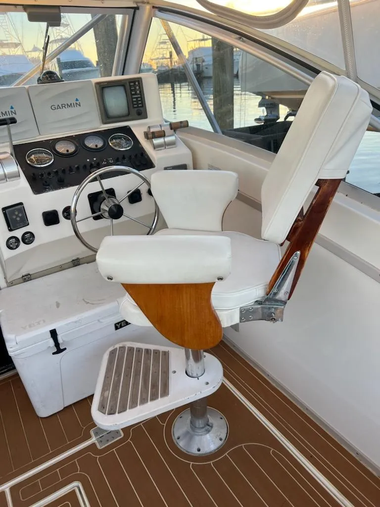 Slide: The Image of 1998 Albemarle 320 Express Fisherman helm with captain's chair and navigation instruments. - 20
