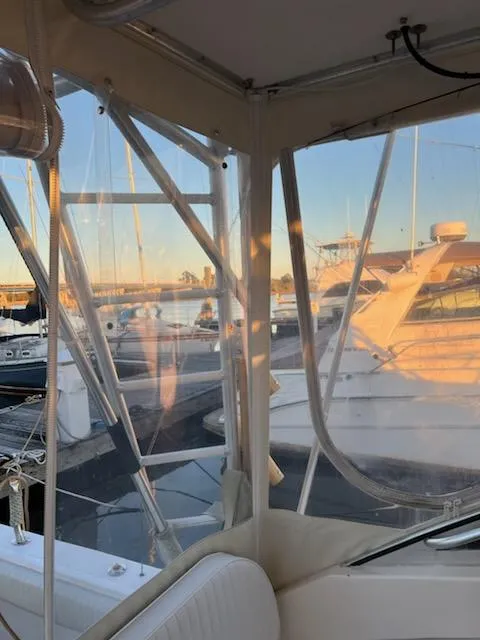 Slide: The Image of 1998 Albemarle 320 Express Fisherman docked at sunset, marina view. - 24