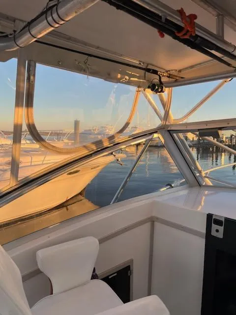 Slide: The Image of Interior view of 1998 Albemarle 320 Express Fisherman boat at sunset. - 27