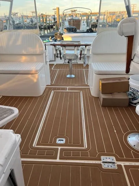 Slide: The Image of 1998 Albemarle 320 Express Fisherman boat interior with teak flooring and seating. - 28