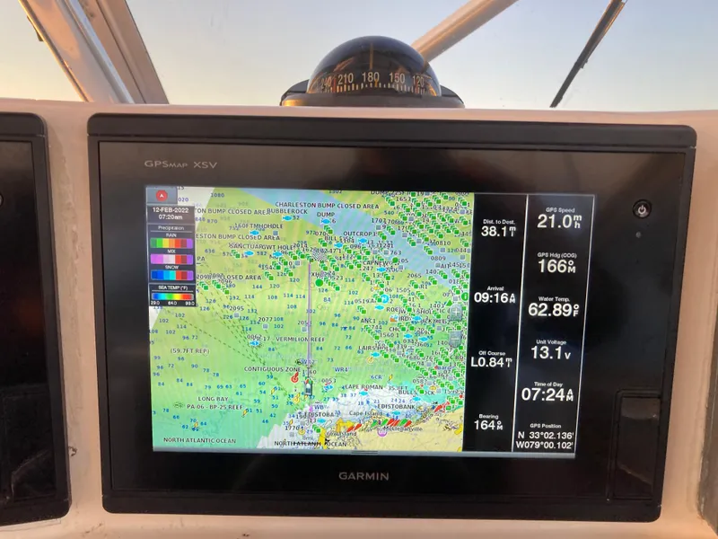 Slide: The Image of Garmin GPS display on 1998 Albemarle 320 Express Fisherman boat, showing navigation data and map. - 30