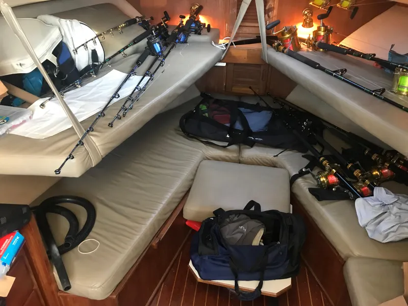 Slide: The Image of Interior of 1998 Albemarle 320 Express Fisherman with fishing gear and rods. - 33