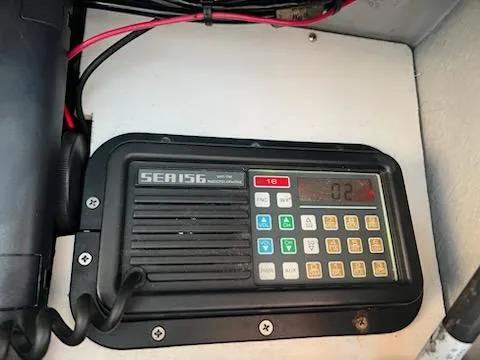 Slide: The Image of Marine radio on 1998 Albemarle 320 Express Fisherman boat dashboard. - 40