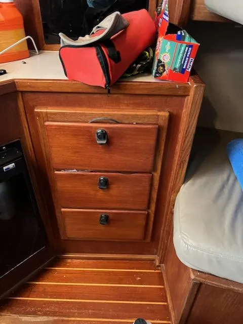 Slide: The Image of 1998 Albemarle 320 Express Fisherman cabin with wooden drawers and storage. - 45