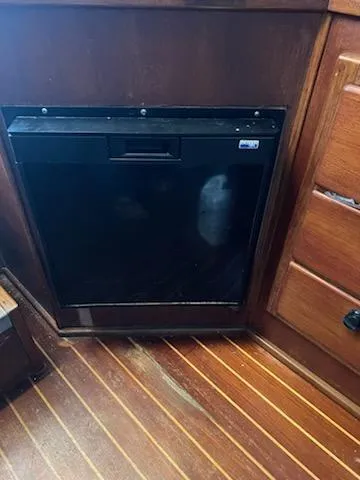 Slide: The Image of 1998 Albemarle 320 Express Fisherman interior with wooden cabinetry and built-in appliance. - 47