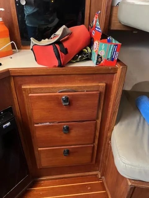 Slide: The Image of Wooden cabin interior of 1998 Albemarle 320 Express Fisherman with storage drawers. - 48