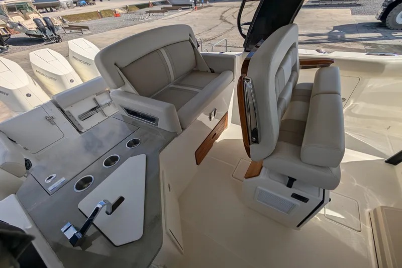 Slide: The Image of 2024 Boston Whaler 350 Realm interior with luxurious seating and modern design. - 10