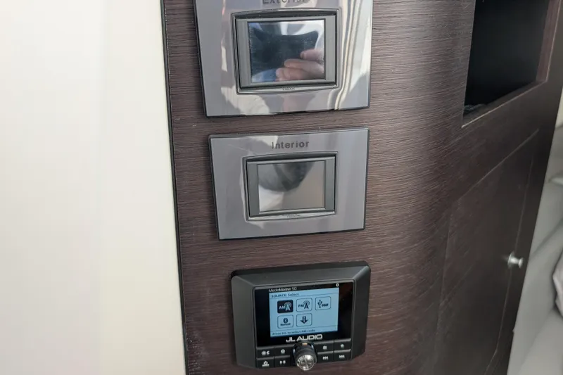 Slide: The Image of Control panel on 2024 Boston Whaler 350 Realm boat, featuring JL Audio system. - 27