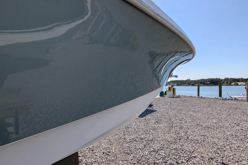 Slide: The Image of 2024 Boston Whaler 350 Realm boat hull by the waterfront. - 37