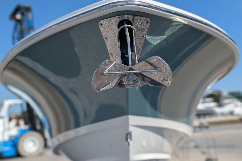 Slide: The Image of 2024 Boston Whaler 350 Realm boat with a polished anchor, viewed from the bow. - 42