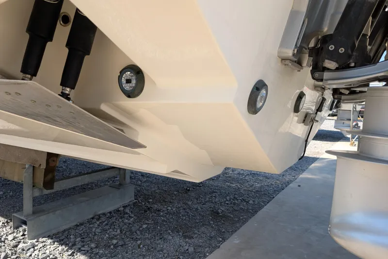 Slide: The Image of 2024 Boston Whaler 350 Realm boat hull and trim tabs detail. - 43