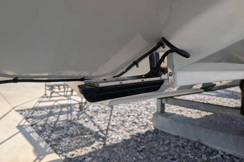 Slide: The Image of Close-up of 2024 Boston Whaler 350 Realm boat hull detail on trailer. - 45