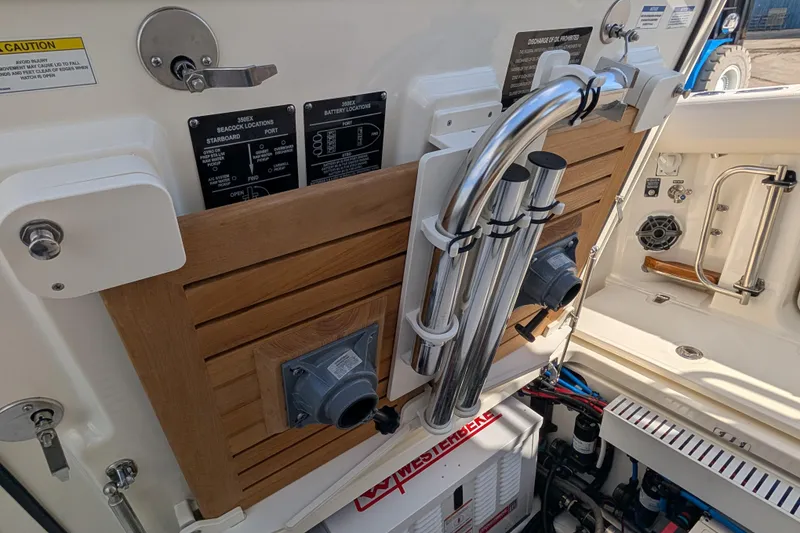 Slide: The Image of 2024 Boston Whaler 350 Realm boat interior with control panels and equipment. - 57