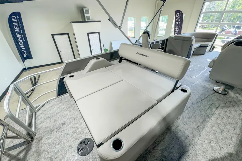 Slide: The Image of 2024 Berkshire 24UL LE B pontoon boat interior with plush seating and modern design. - 10