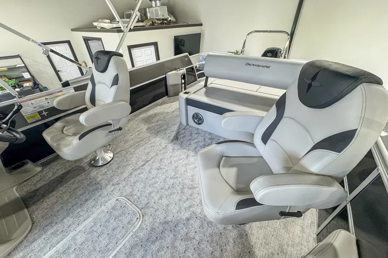 Slide: The Image of 2024 Berkshire 24UL LE B boat interior with plush seating and modern design. - 11
