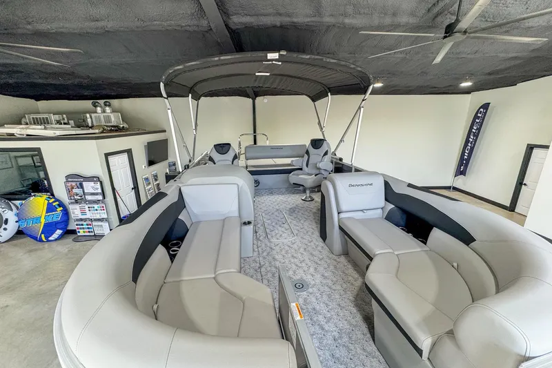 Slide: The Image of 2024 Berkshire 24UL LE B pontoon boat interior with spacious seating and canopy. - 4