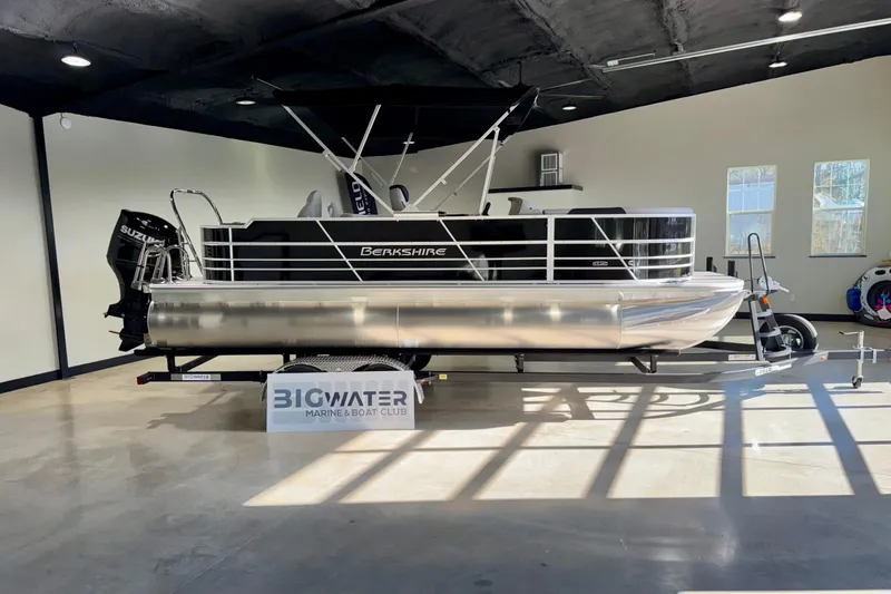 Slide: The Image of Interior of 2025 Berkshire 24RFC LE pontoon boat with modern seating and helm. - 11