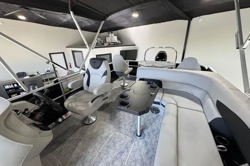 Slide: The Image of 2025 Berkshire 24RFC LE pontoon boat with Suzuki 150 engine in showroom. - 4